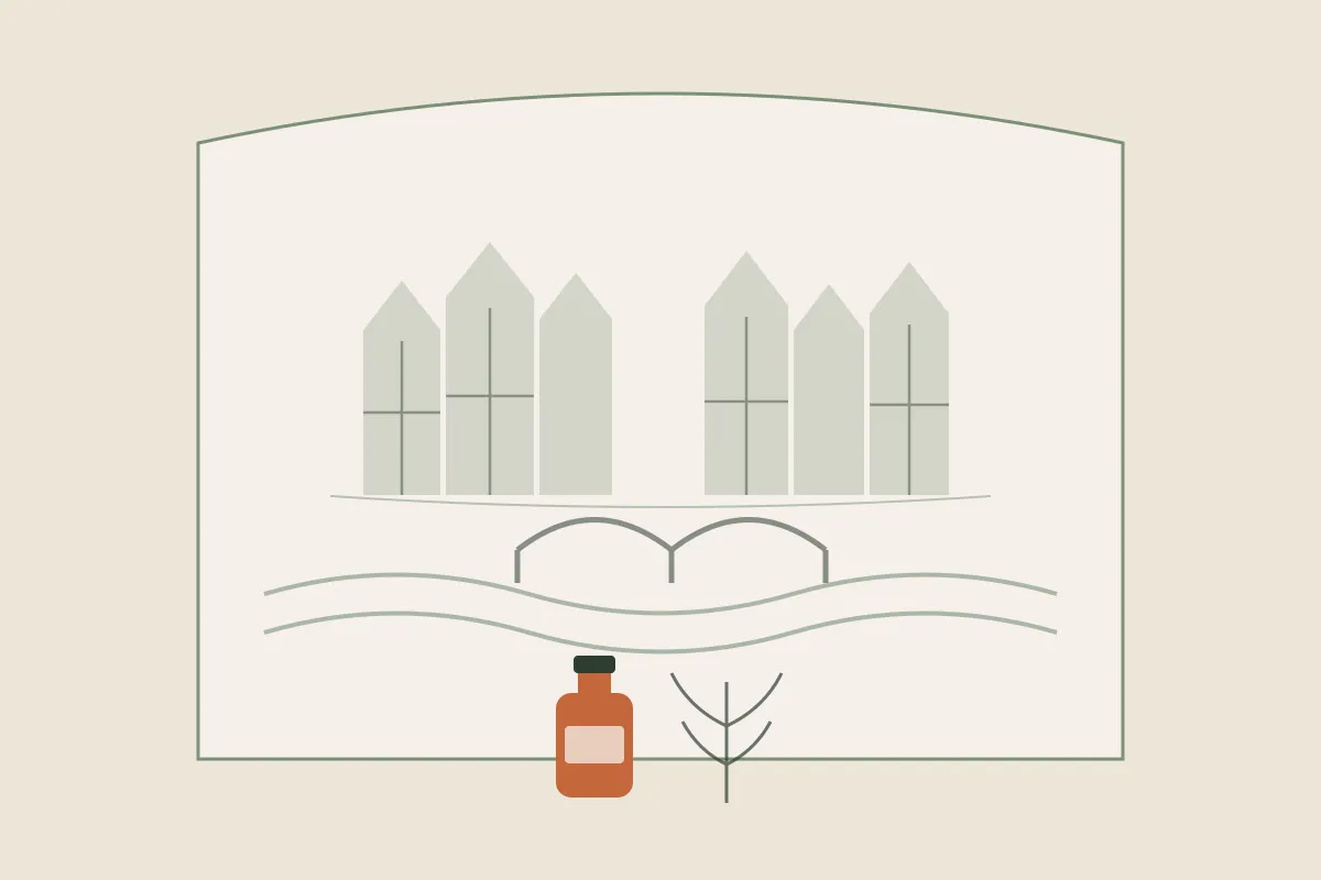 Illustration des maisons à colombages de Chalon-sur-Saône au bord de la Saône, avec un pont, un flacon d'huile de massage et un brin végétal, dans une arche aux couleurs de Yes Mama